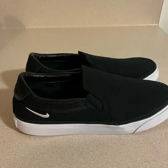 Nike Court Legacy Black and White Slip-On Sneakers